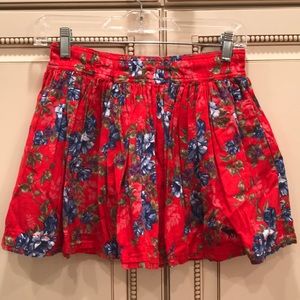 Hollister Red skirt with blue and white flowers.